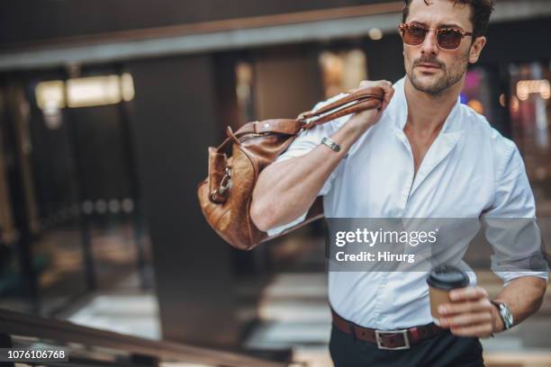 tornare a casa - elegant handsome beard man foto e immagini stock