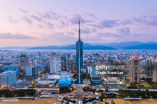 panorama of fukuoka tower aerial view from drone at sunset along with momochi beach, fukuoka prefecture, japan - 塔 ストックフォトと画像