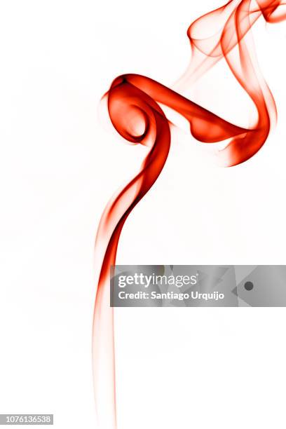 red smoke spiral - wispy stock pictures, royalty-free photos & images