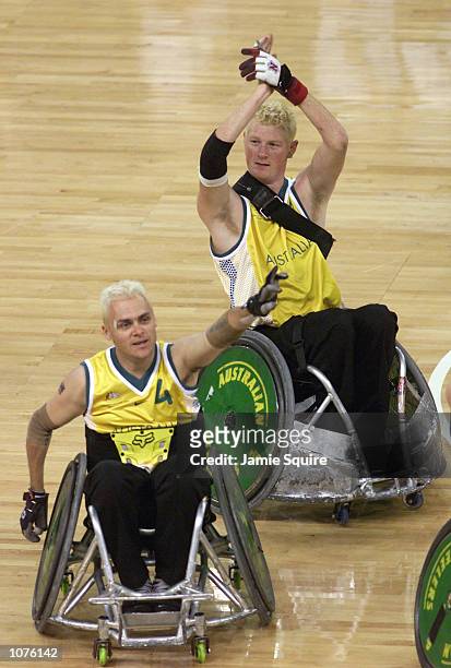 Peter Harding and Brad Dubberley of Australia celebrate as Australia defeat Switzerland 42-32 in the Pool A Rugby Wheelchair game in The Dome during...