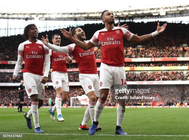 Pierre-Emerick Aubameyang of Arsenal celebrates scoring from the penalty spot during the Premier League match between Arsenal FC and Tottenham...