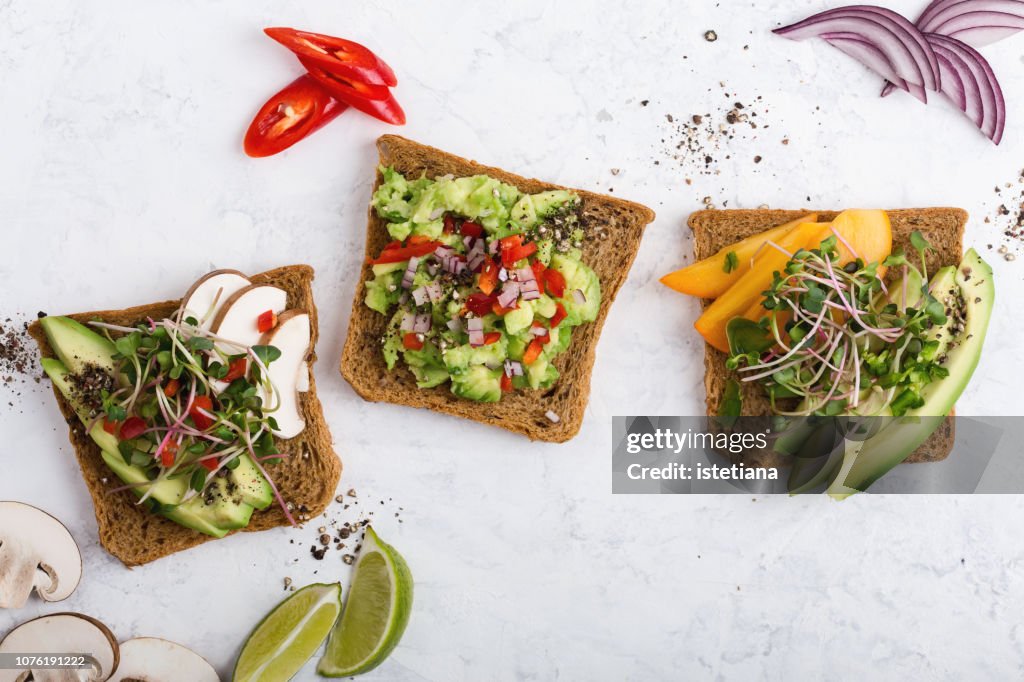 Plant based colorful vegan snack, variety of avocado toasts