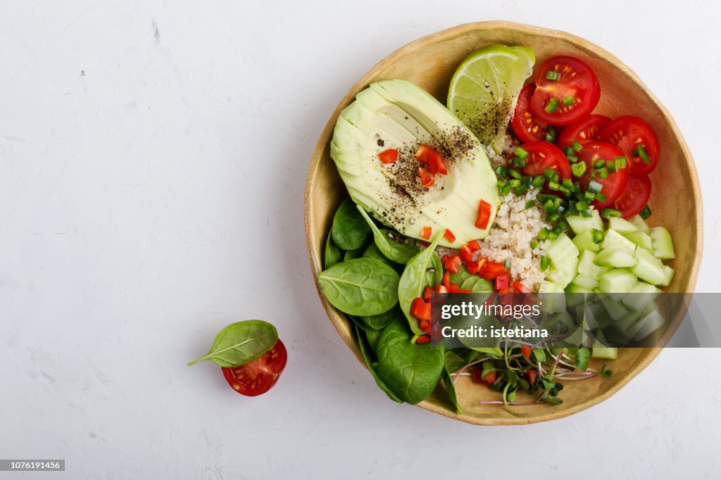 Quinoa veggie bowl with fresh vegetables and fruits