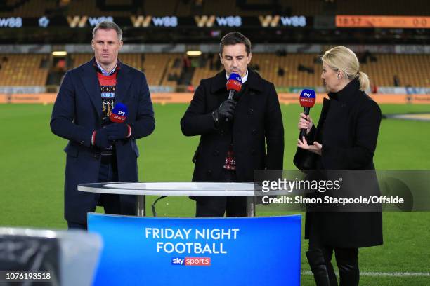 Sky Sports television presenter Kelly Cates speaks to pitchside pundits Gary Neville and Jamie Carragher before the Premier League match between...