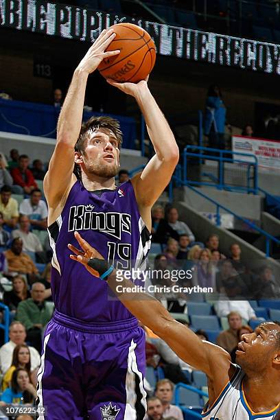 Beno Udrih of the Sacramento Kings shoots the ball over Willie Green of the New Orleans Hornets at the New Orleans Arena on December 15, 2010 in New...