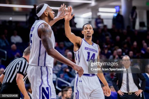 Northwestern Wildcats guard Ryan Taylor and and Northwestern Wildcats center Dererk Pardon celebrate during a game between the Columbia Lions and the...