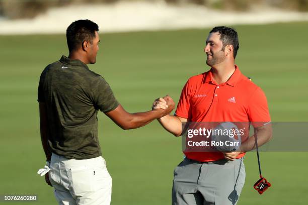 Jon Rahm of Spain shakes hands with Tony Finau of the United States after winning the Hero World Challenge at Albany, Bahamas on December 02, 2018 in...