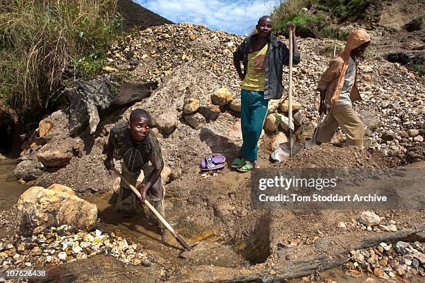 2nd MAY 2009: A young man pictured at work in a stream at the Szibira mine. In the Democratic Republic of Congo around 1,500 people die every day...