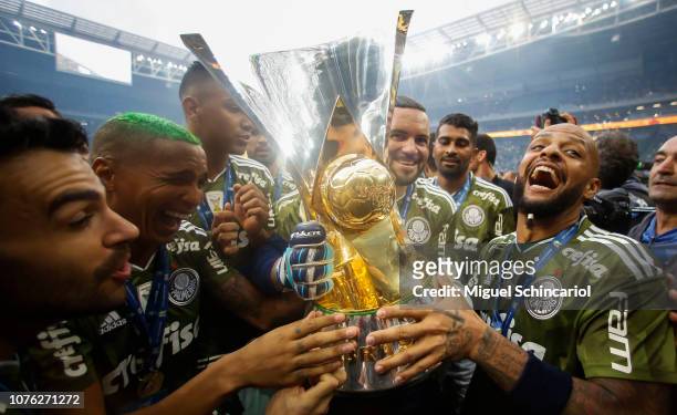 Deyverson and Felipe Melo of Palmeiras hold the trophy after winning the Brasileirao 2018 after the match against Vitora at Allianz Parque on...