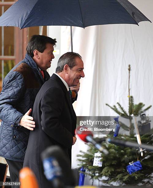 Lawrence Gonzi, Malta's prime minister, right, arrives for the European Peoples Party meeting ahead of the European Union leaders summit in Meise,...