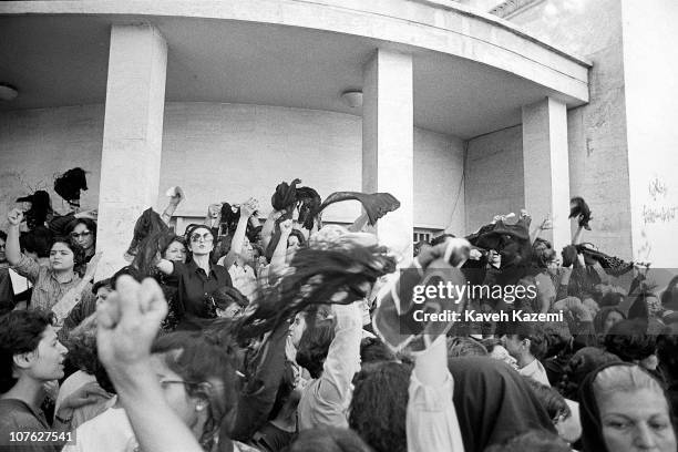 Group of women protest against wearing the Islamic veil, while waving their veils in the air outside the office of the Prime Minister, Tehran, Iran,...