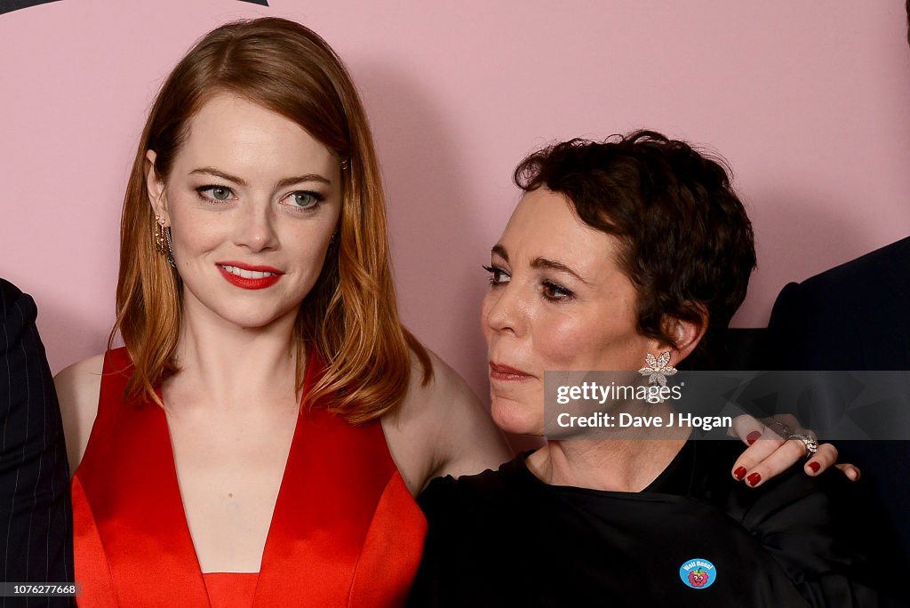 Emma Stone and Olivia Colman pose in the winners room at the 21st