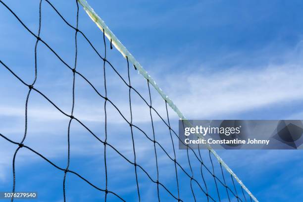 volleyball net view from low angle against blue sky - kota kinabalu beach stock pictures, royalty-free photos & images