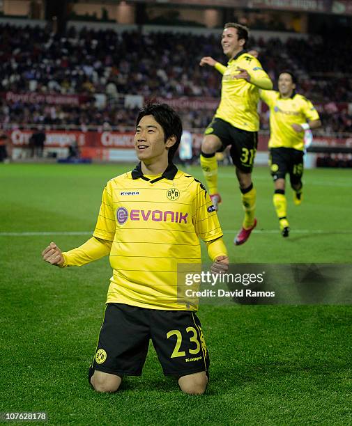 Shinji Kagawa of Borussia Dortmund celebrates after scoring the opening goal during the UEFA Europa League group J match between Sevilla and Borussia...