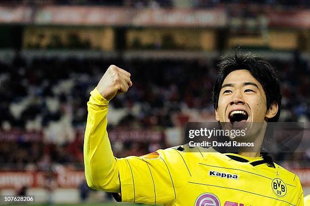 Shinji Kagawa of Borussia Dortmund celebrates after scoring the opening goal during the UEFA Europa League group J match between Sevilla and Borussia...