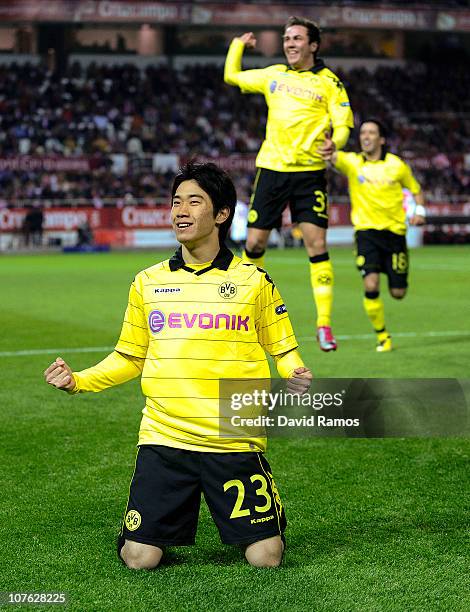 Shinji Kagawa of Borussia Dortmund celebrates after scoring the opening goal during the UEFA Europa League group J match between Sevilla and Borussia...