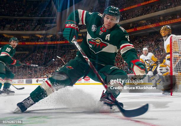 Zach Parise of the Minnesota Wild tries to glove a flying puck during a game with the Pittsburgh Penguins at Xcel Energy Center on December 31, 2018...