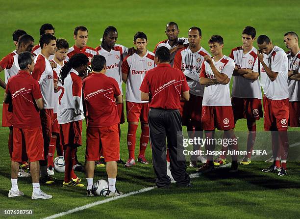 Head coach Celso Roth of Sport Club Internacional lectures his players during a training session at the Sultan bin Zayed training ground on December...