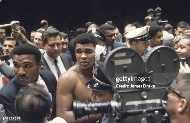 World Heavyweight Title: Cassius Clay surrounded by crowd in ring after fight vs Cleveland Williams at Houston Astrodome.Houston, TX CREDIT: James...