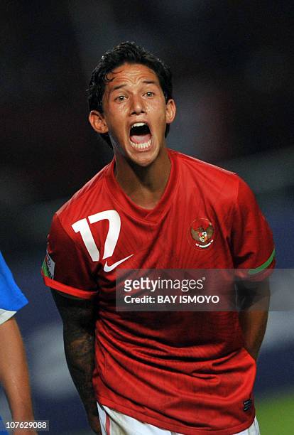 Indonesian striker Irfan Bachdim shouts to his teammates during their first of the two round semi-final game against the Philippines in the AFF...
