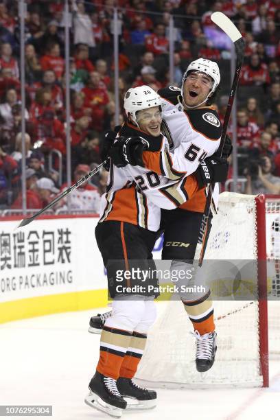 Pontus Aberg of the Anaheim Ducks celebrates his game-winning goal with teammate Kiefer Sherwood against the Washington Capitals during the third...