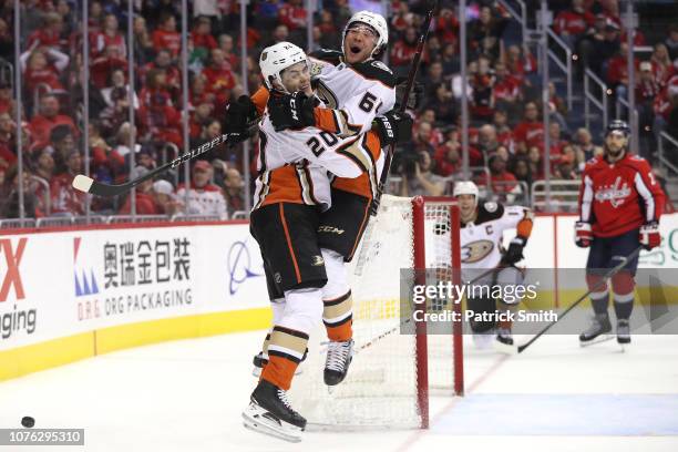 Pontus Aberg of the Anaheim Ducks celebrates his game-winning goal with teammate Kiefer Sherwood against the Washington Capitals during the third...