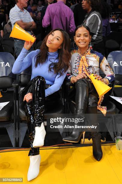 Personality Jeannie Mai and Christina Milian attend a basketball game between the Los Angeles Lakers and the Phoenix Suns at Staples Center on...