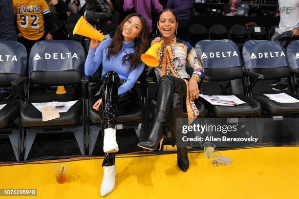 Personality Jeannie Mai and Christina Milian attend a basketball game between the Los Angeles Lakers and the Phoenix Suns at Staples Center on...