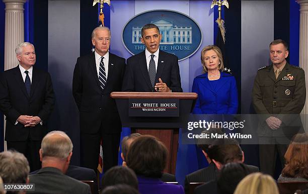 President Barack Obama is flanked by Vice President Joseph Biden , Secretary of Defense Robert Gates , Secretary of State Hillary Clinton and Vice...