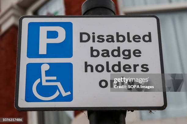 Blue badge signpost. Many councils failed to take action against motorists misusing disabled parking permits in the past 12 months, despite thefts...