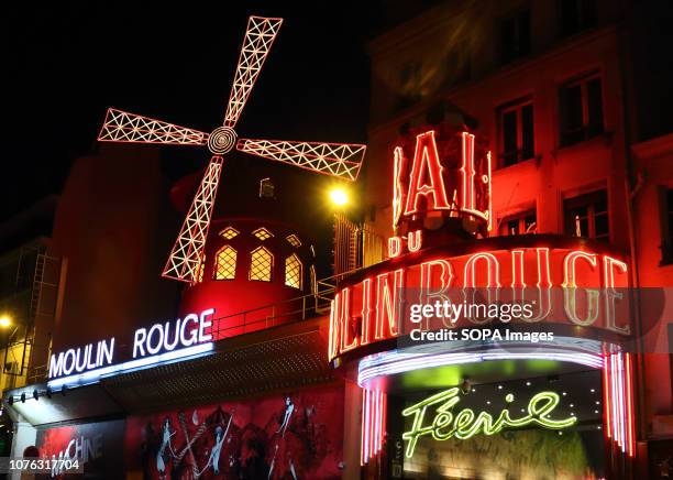 Moulin Rouge logo seen in Paris. The legendary Moulin Rouge is a night club in Montmartre, Paris.