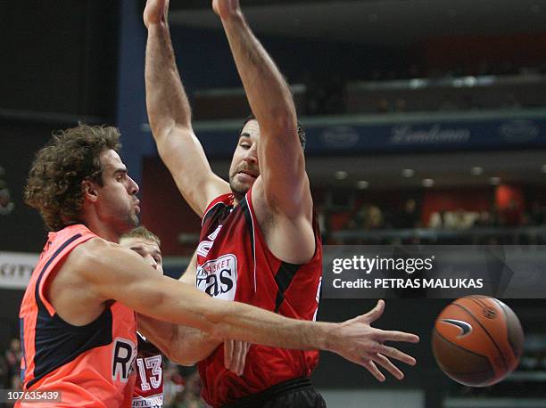 Lietuvos Rytas' Cemal Nalga vies with Regal FC Barcelona's Roger Grimau during their Euroleague basketball group match in Vilnius, on December 16,...