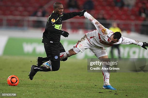 Eric Djemba-Djemba of Odense is challenged by Timo Gebhart of Stuttgart during the UEFA Europa League group H match between VfB Stuttgart and Odense...