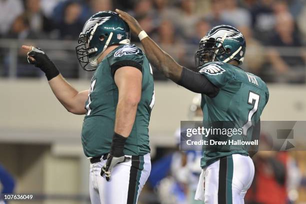 Quarterback Michael Vick and guard Mike McGlynn of the Philadelphia Eagles celebrate a touchdown during the game against the Dallas Cowboys at...