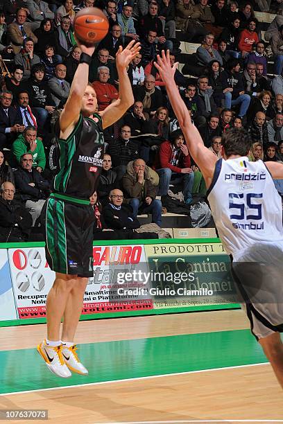 Rimantas Kaukenas,#13 of Montepaschi Siena shoots for the basket over Emir Preldzic of Fenerbahce Ulker Istanbul during the 2010-2011 Turkish...