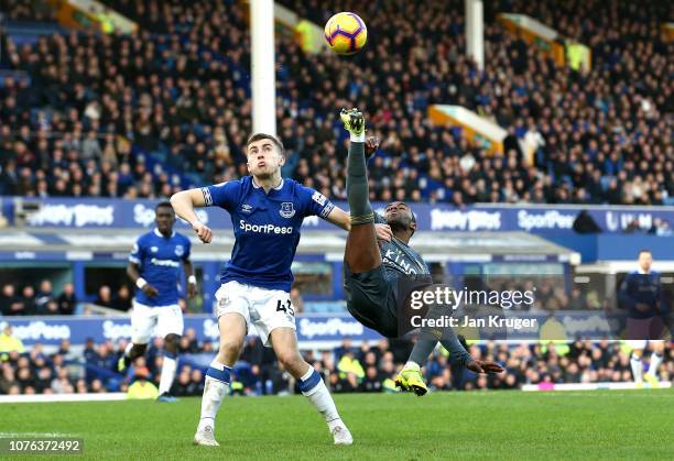 Ricardo Pereira of Leicester City crosses the ball as he is closed down by Jonjoe Kenny of Everton during the Premier League match between Everton FC...