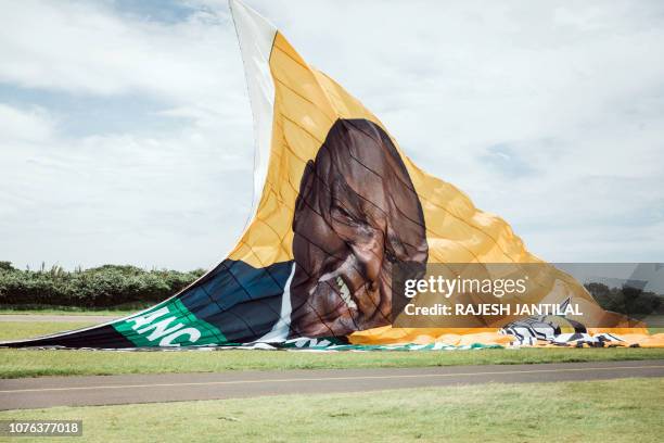 Giant flag from the South African ruling Party African National Congress displaying a picture of South African president Cyril Ramaphosa and urging...