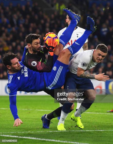Hugo Lloris and Kieran Trippier of Tottenham Hotspur foil Sean Morrison of Cardiff City during the Premier League match between Cardiff City and...