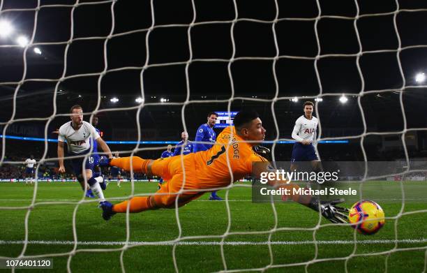 Harry Kane of Tottenham Hotspur beats goalkeeper Neil Etheridge of Cardiff City as he scores his team's first goal during the Premier League match...