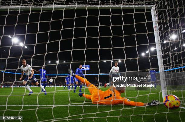Harry Kane of Tottenham Hotspur beats goalkeeper Neil Etheridge of Cardiff City as he scores his team's first goal during the Premier League match...