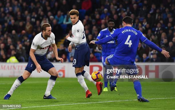 Tottenham Hotspur's English striker Harry Kane scores his team's first goal during the English Premier League football match between between Cardiff...