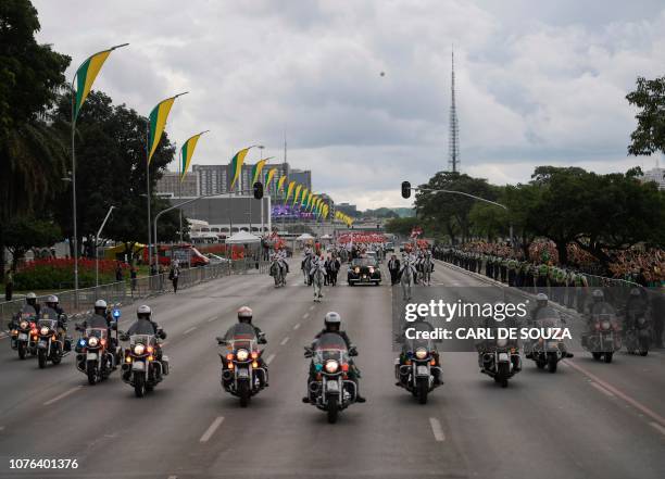 The presidential convoy, led by Brazil's President-elect Jair Bolsonaro and his wife Michelle Bolsonaro in a Rolls Royce, heads to the National...