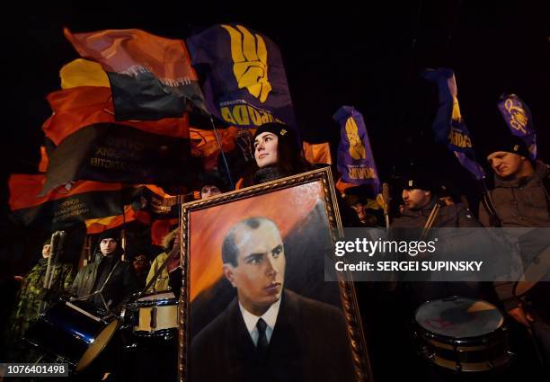People gather for a march in Kiev on January 1, 2019 to mark the 110th anniversary of the birth of Ukrainian politician Stepan Bandera , one of the...