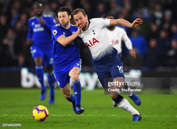 Harry Kane of Tottenham Hotspur and Harry Arter of Cardiff City battle for the ball during the Premier League match between Cardiff City and...