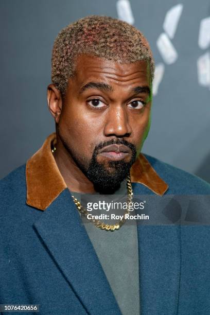 Kanye West attends the the Versace fall 2019 fashion show at the American Stock Exchange Building in lower Manhattan on December 02, 2018 in New York...