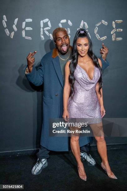 Kanye West and Kim Kardashian West attend the the Versace fall 2019 fashion show at the American Stock Exchange Building in lower Manhattan on...
