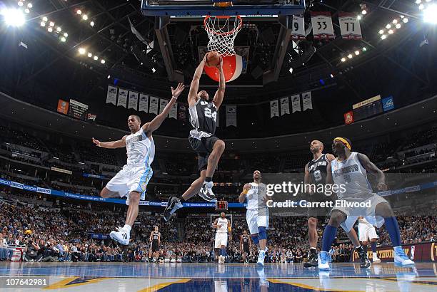 Richard Jefferson of the San Antonio Spurs goes to the basket against Aaron Afflalo of the Denver Nuggets on December 16, 2010 at the Pepsi Center in...