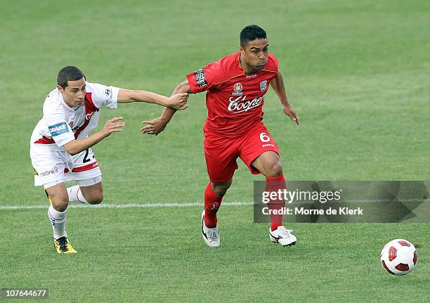 Cassio of Adelaide gets away from Adrian Zahra of the Heart during the round 19 A-League match between Adelaide United and the Melbourne Heart at...