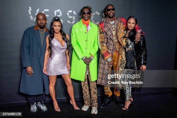 Kanye West, Kim Kardashian West, Young Thug, 2 Chainz and Kesha Ward attend the the Versace fall 2019 fashion show at the American Stock Exchange...