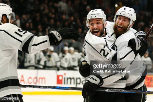 Alec Martinez of the Los Angeles Kings celebrates his goal with Jake Muzzin of the Los Angeles Kings and Alex Iafallo of the Los Angeles Kings during...